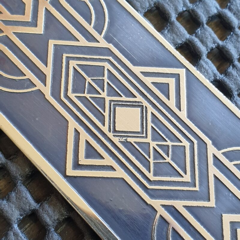 Art Deco inspired pattern, etched in a brass plate